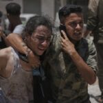 Officials say 85 Palestinians seeking food killed as Israel widens evacuation orders
