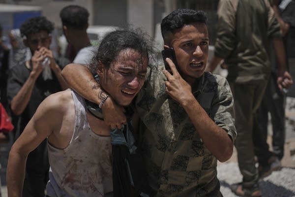 Officials say 85 Palestinians seeking food killed as Israel widens evacuation orders